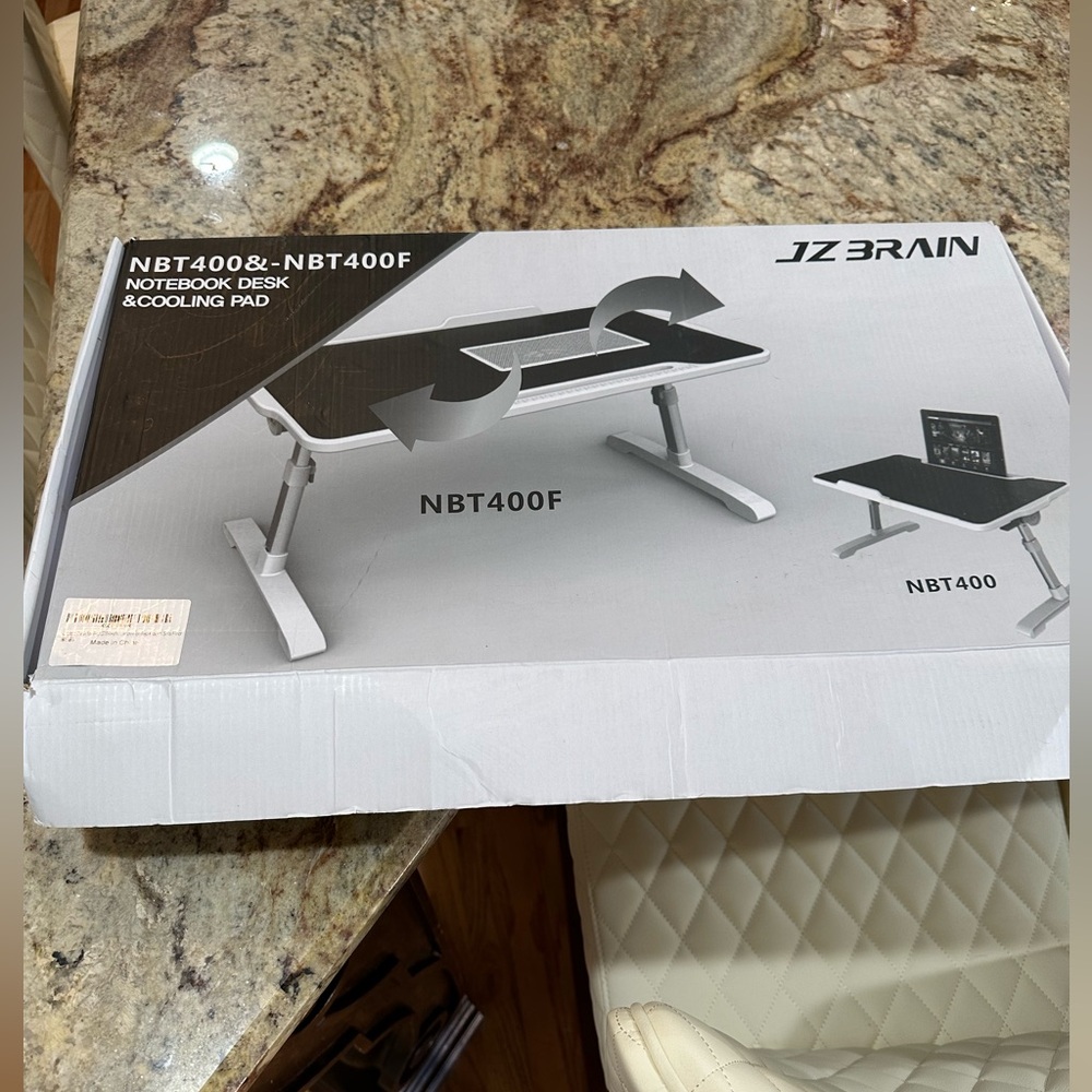 NBT 400F notebook desk and cooling pad. New in box. Box is a little damaged